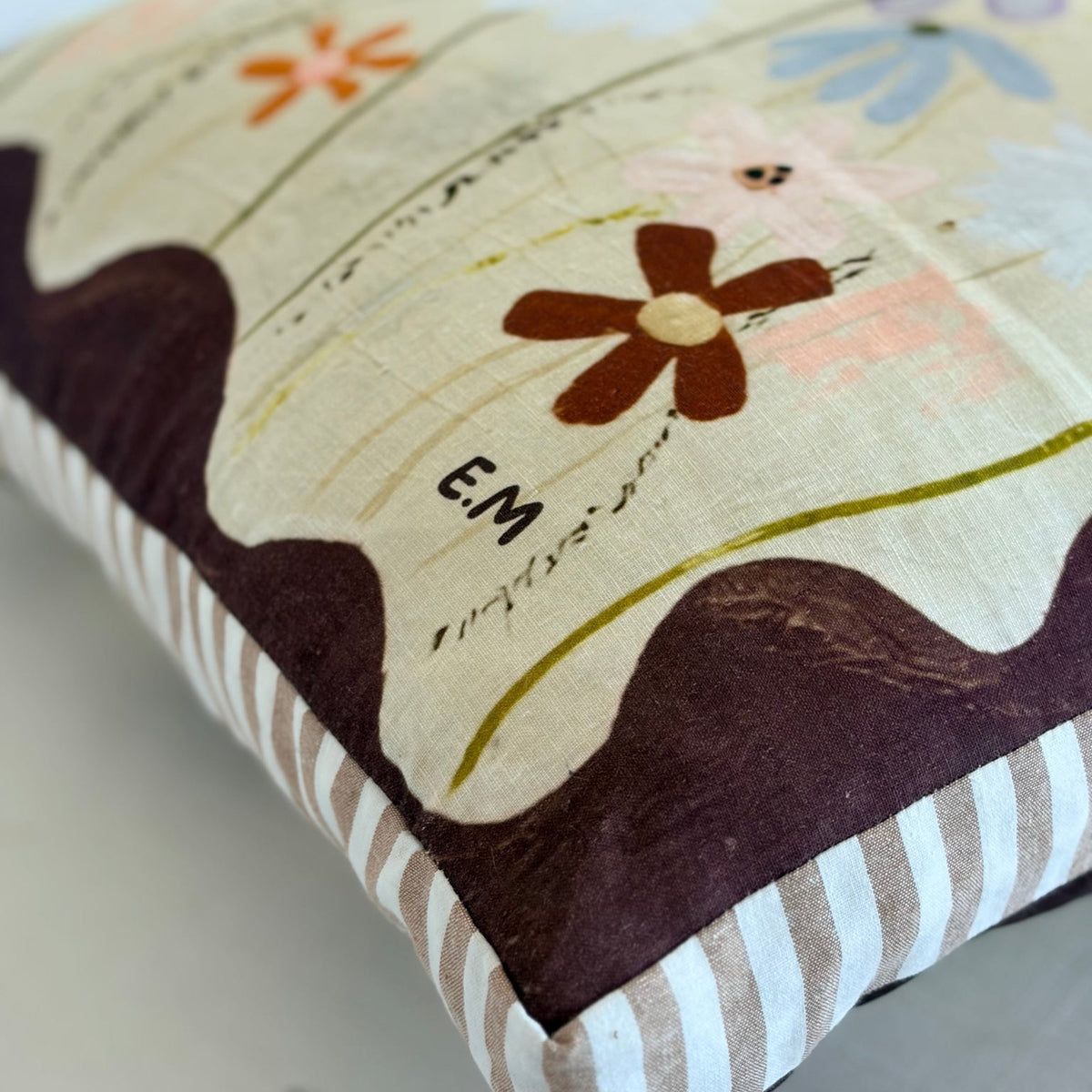 Lost in You French flax linen cushion close-up showing Ella Martin floral artwork and contrasting striped gusset