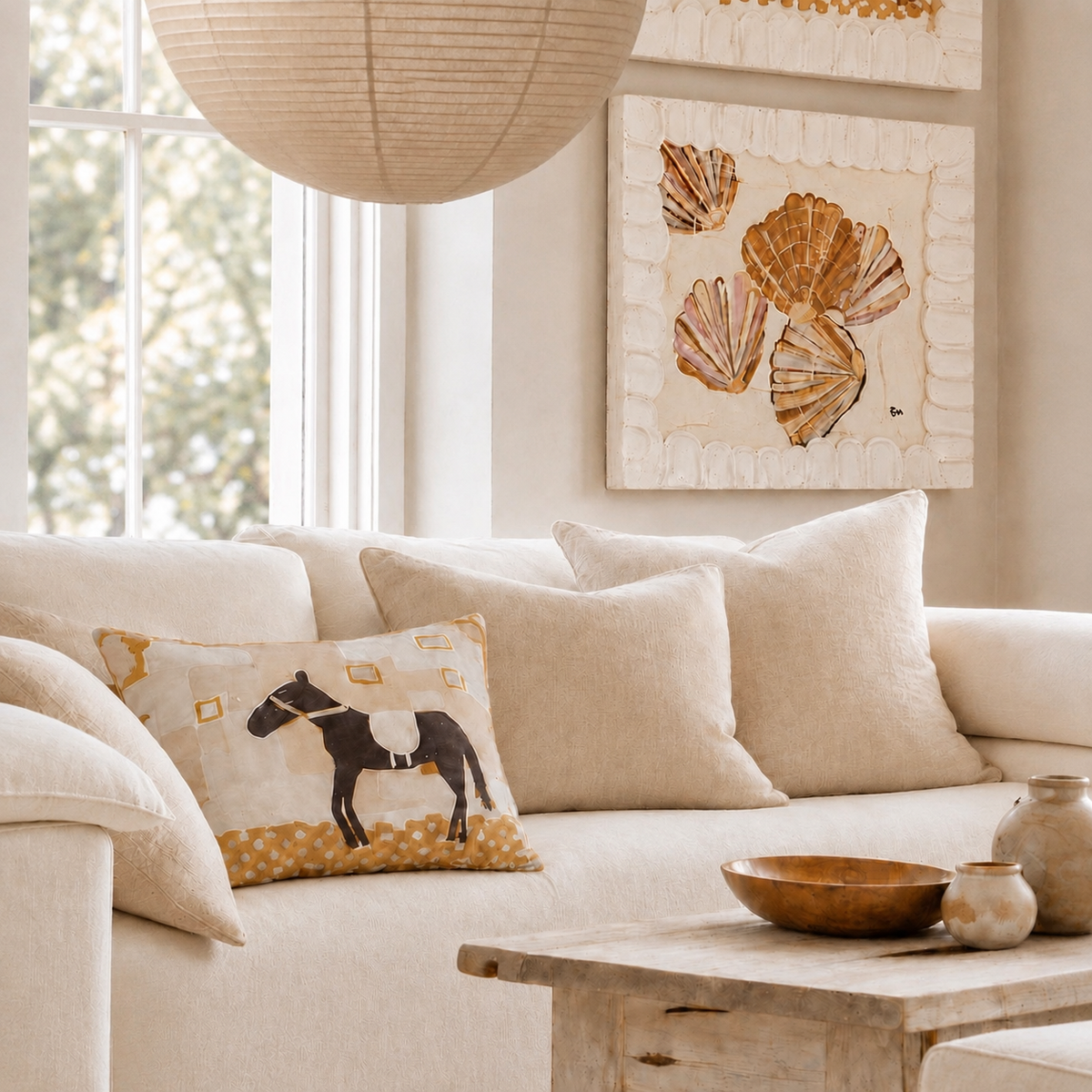Little Nordic Sol ODYS French flax linen horse cushion styled on a neutral sofa in a light-filled living room