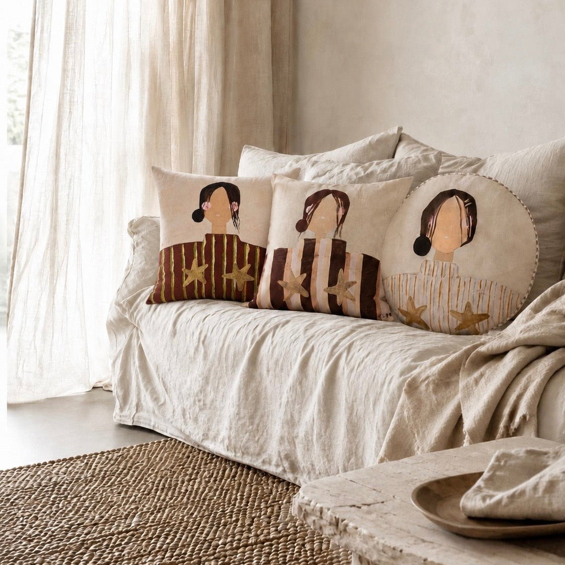 Little Nordic Sol Sisterhood Collection cushions including Sadie styled together on a neutral linen sofa