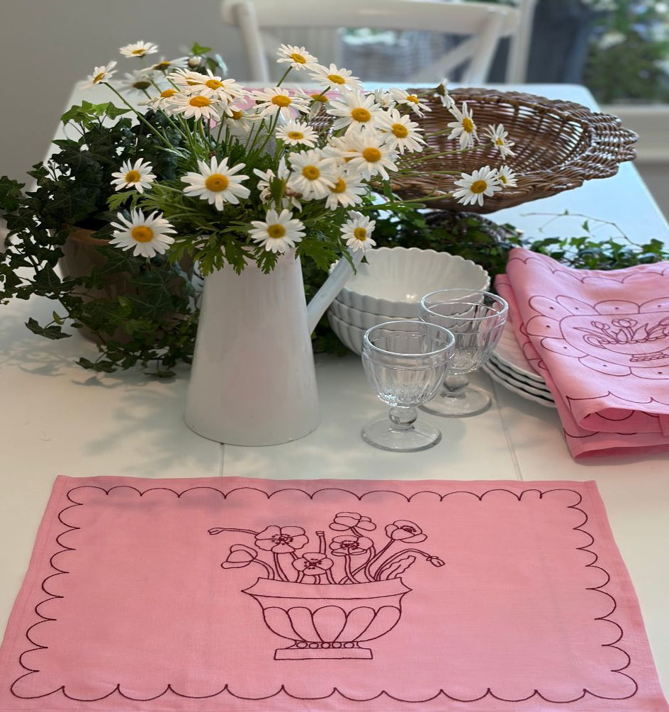 Placemat with poppies embroided.