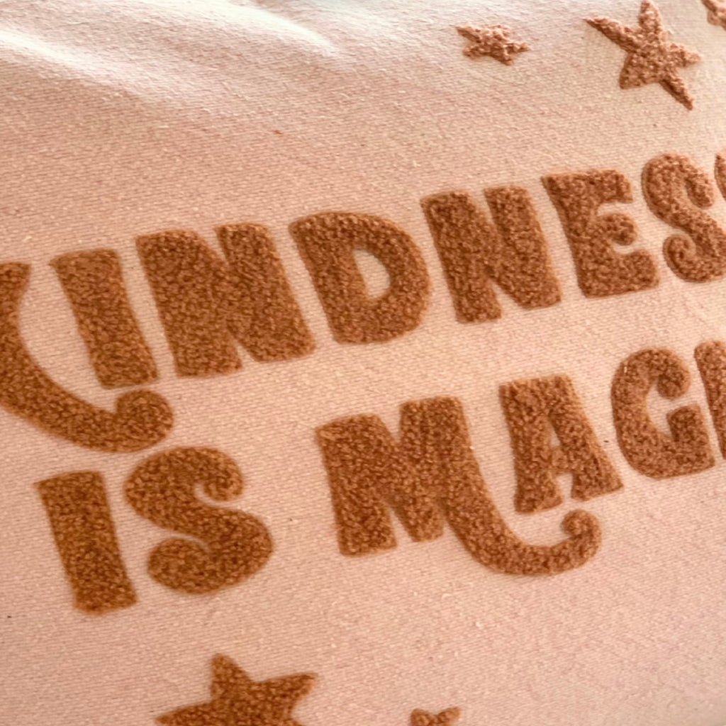 Pink and bronze Kindness is Magic Cushion cover, Cotton Looped design for childern's room decor.