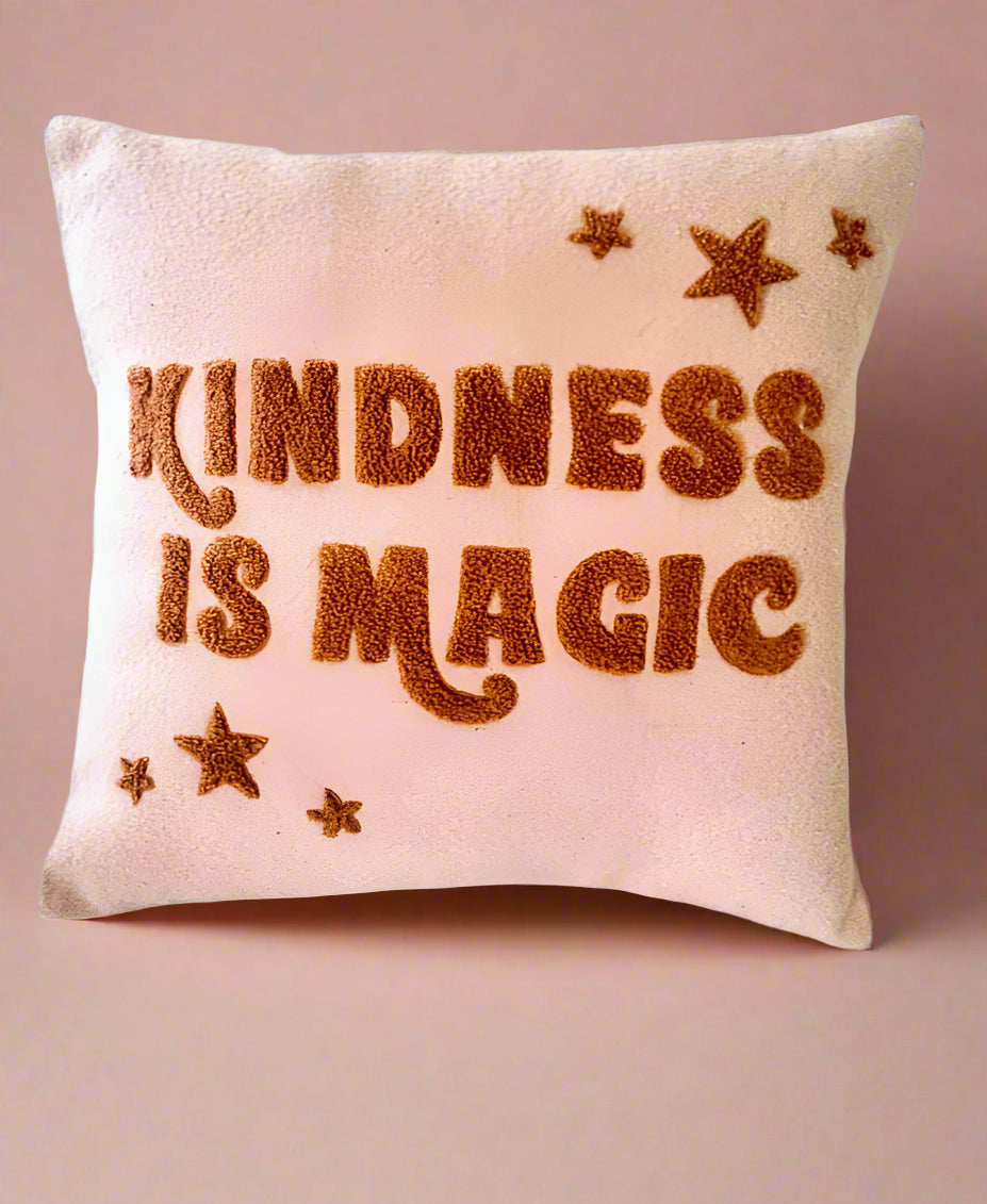 Kindness is magic Looped cushion cover, in pink and bronze, with stars.