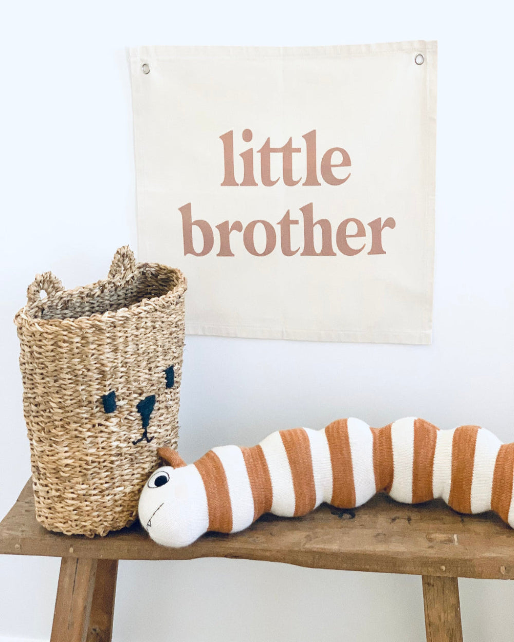 Little Brother wall flag printed on Canvas wall hanging with Bronze writing on natural canvas