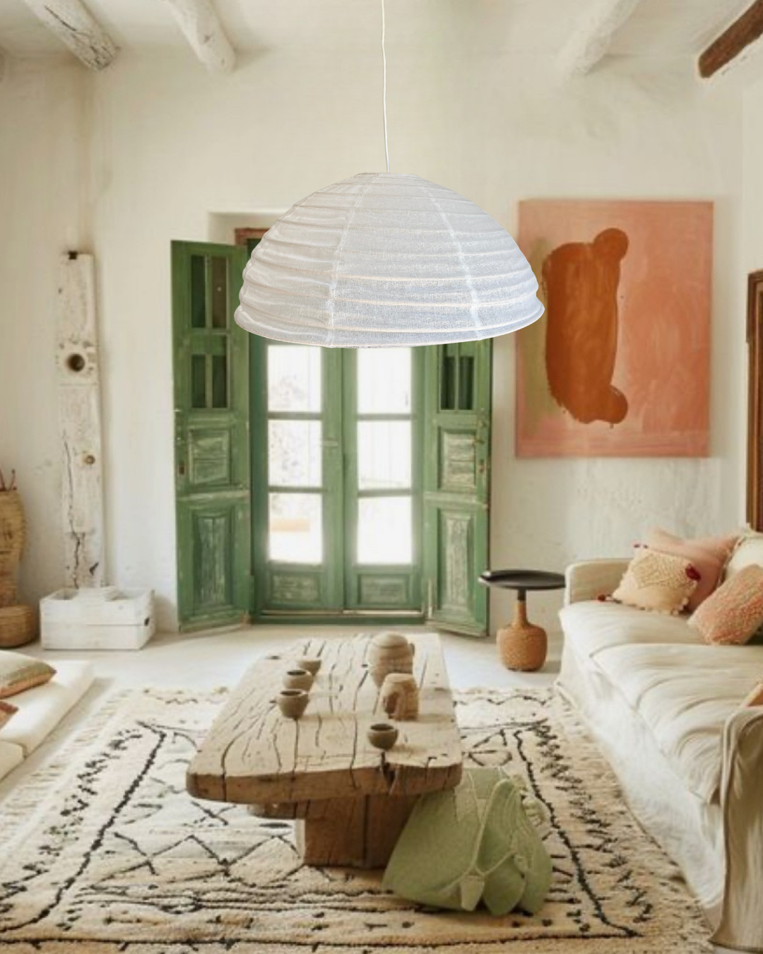 Living room with a white pendant lamp and colourful decor