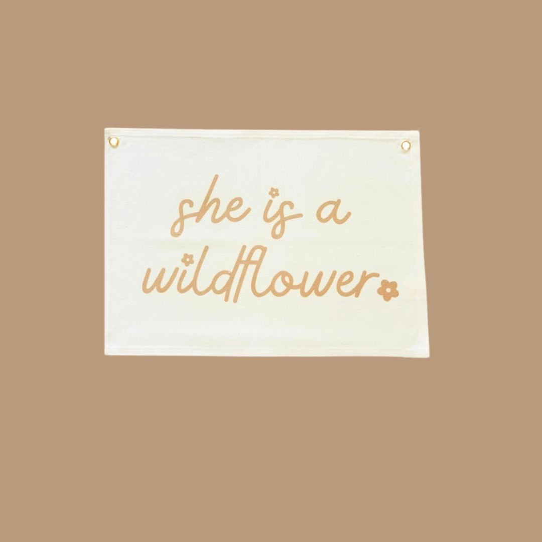Wall banner with saying he is a Wildflower bronze writting on natural canvas wall hanging for girls bedroom.