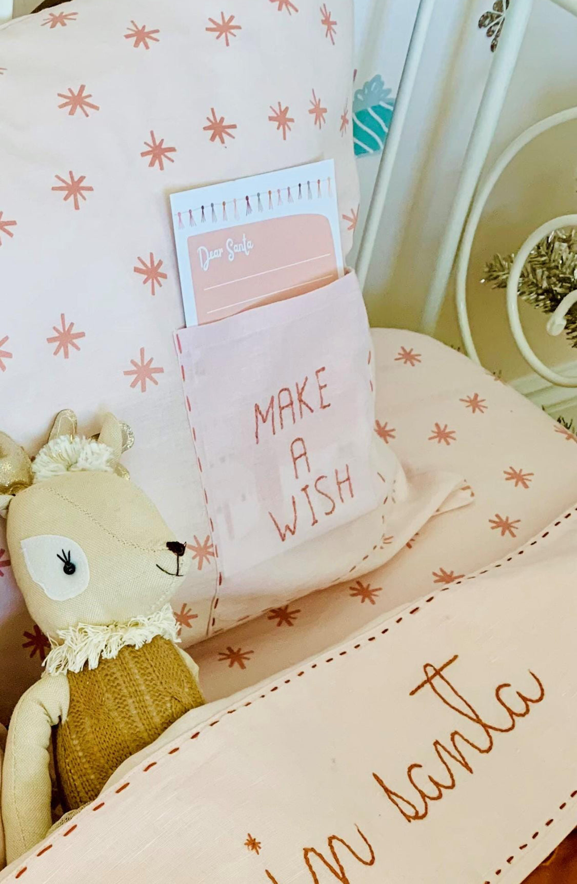  'Make a Wish' text, decorative pillow case with star pattern.