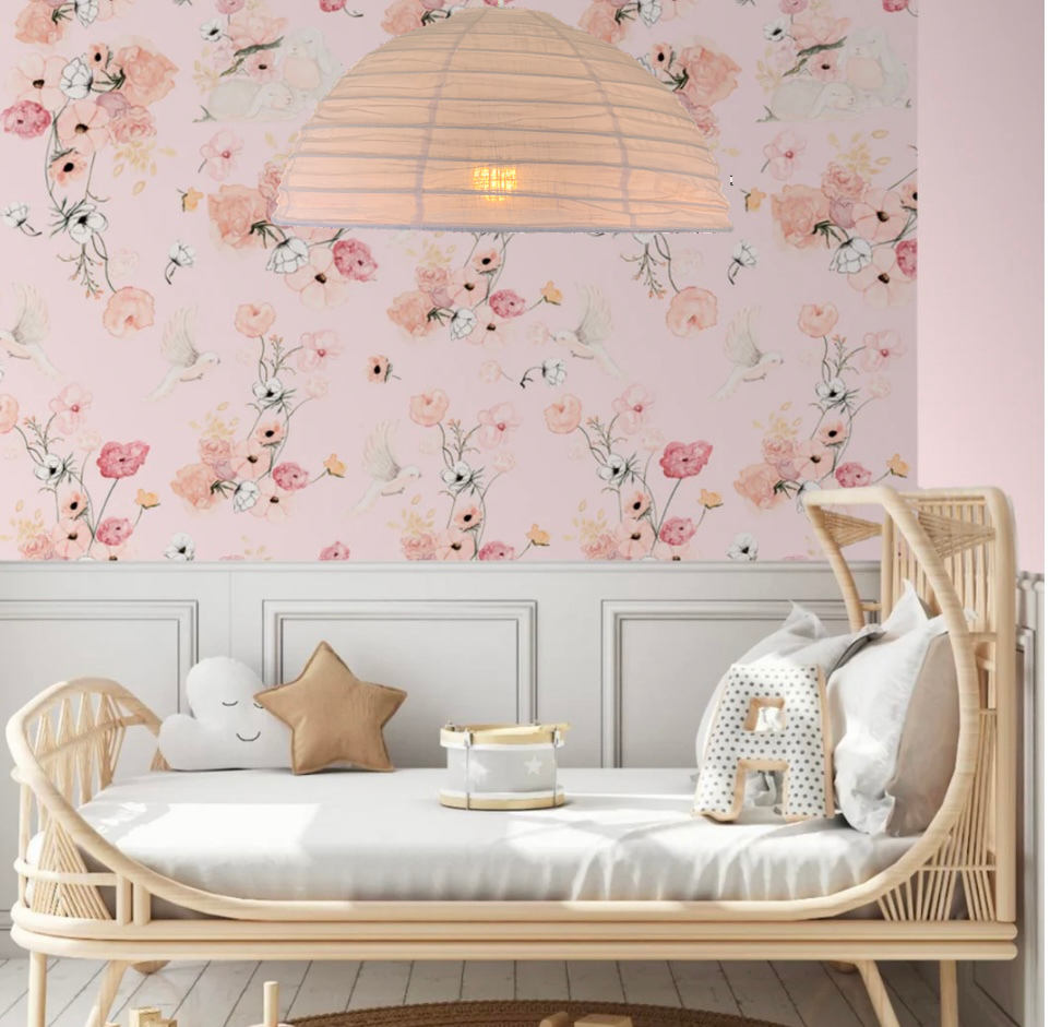 A blush pink linen light shade in a minimalist style, displayed in a room setting with a white daybed in a girl's bedroom.