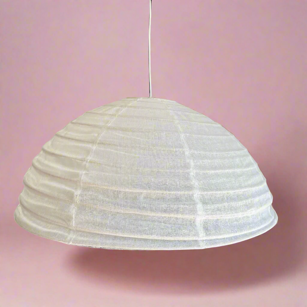 Warm White pendant light with 100% linen fabric creates texture on a neutral background.