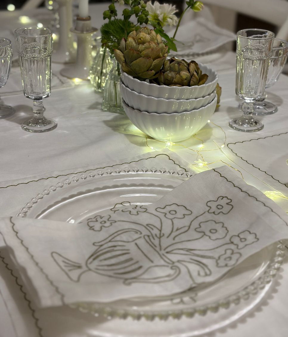 decorative tablescape with embroidered olive green placemats