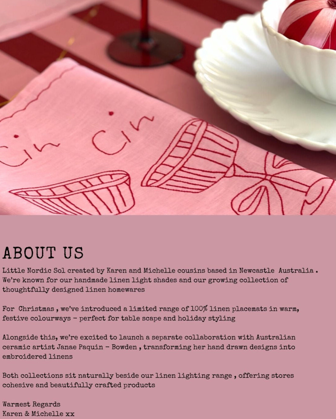 Pink linen placemat with 'Cin Cin' design on a table setting with a teacup.