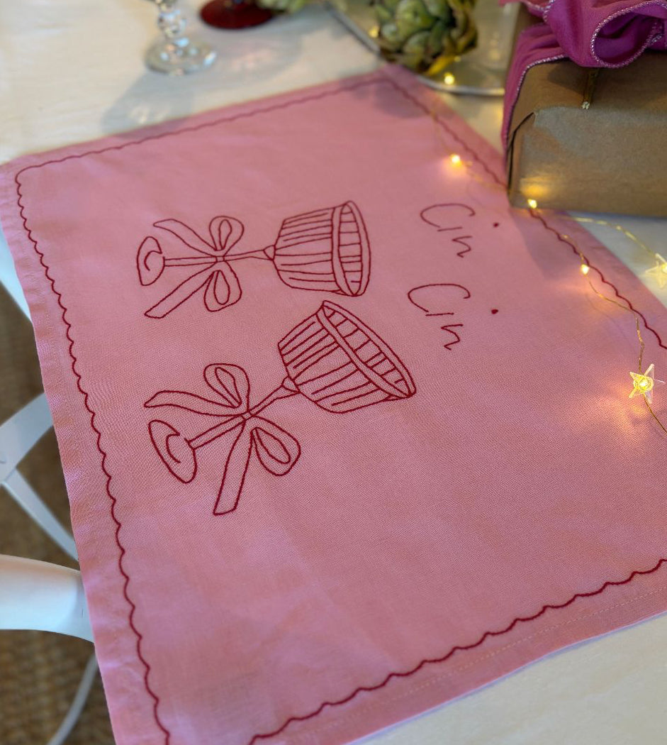 pink embroidered placemat cin cin glasses celebration