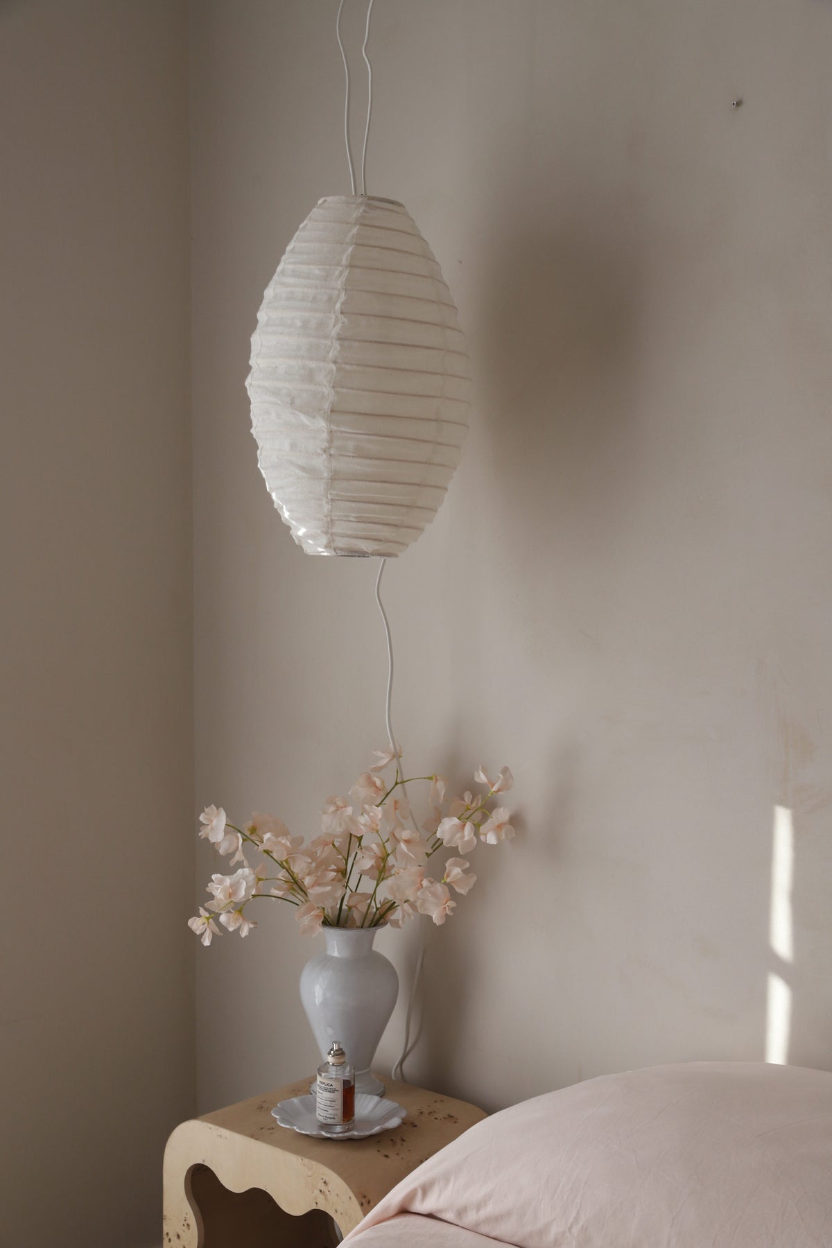 Decorative linen light shade with ribbed bamboo frame.