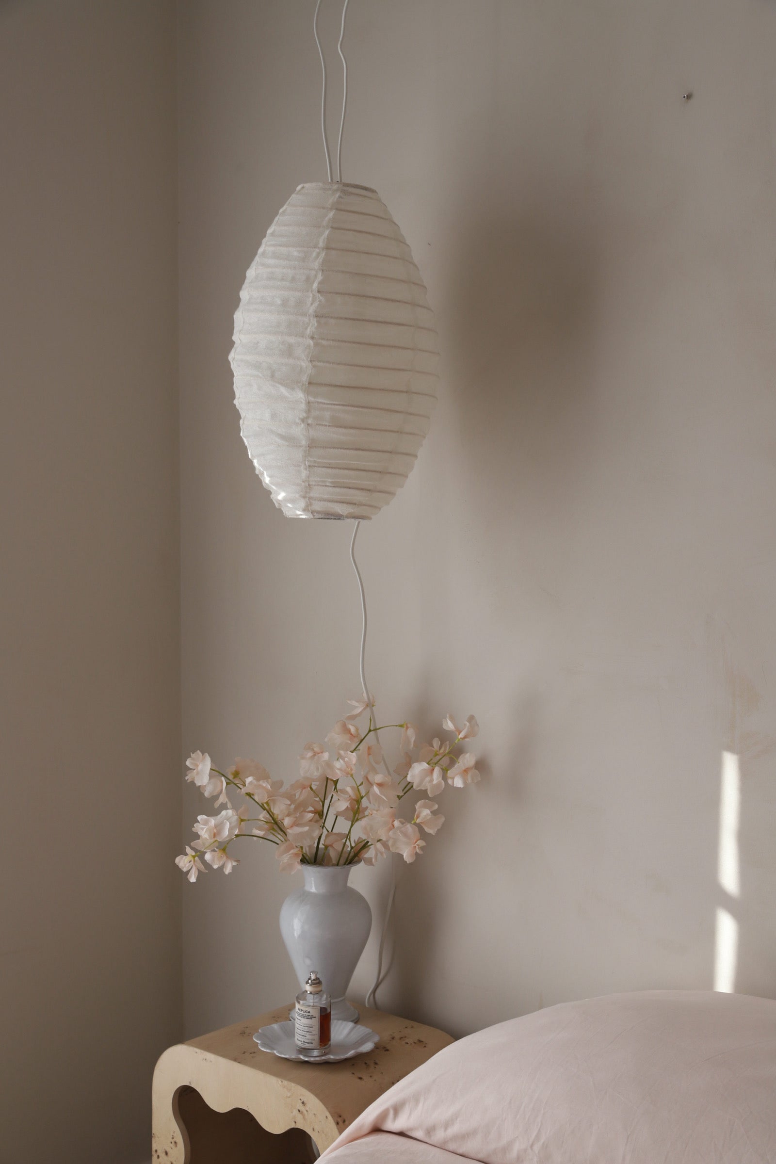 Decorative linen light shade with ribbed bamboo frame.