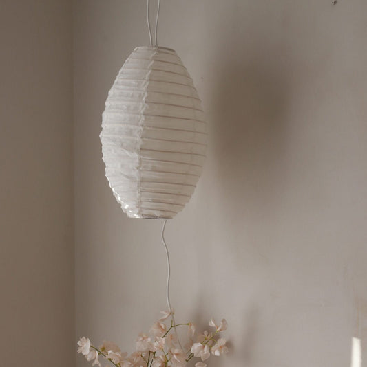 Decorative linen light shade with ribbed bamboo frame.