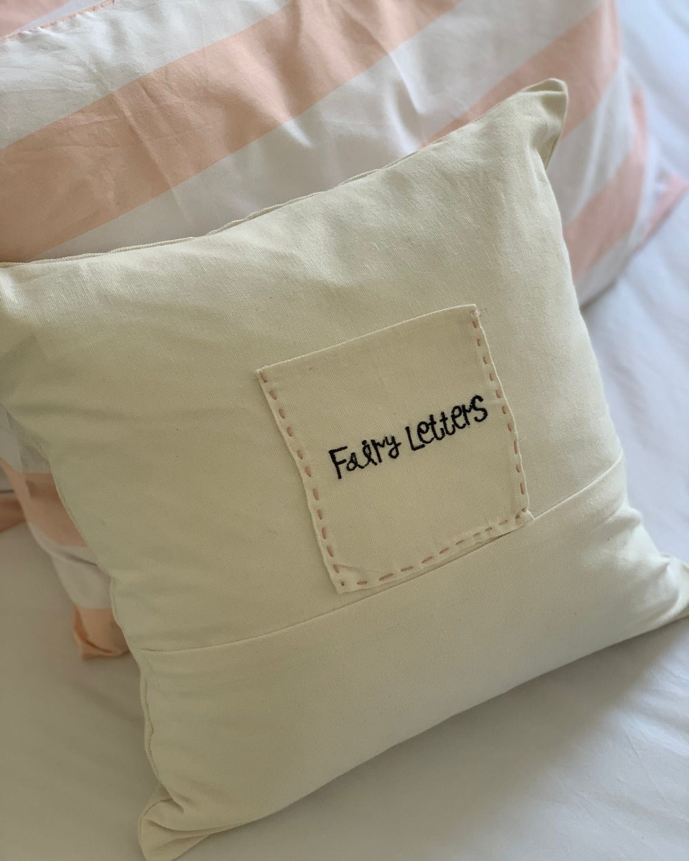 Mushroom tuted cotton cushion showing back hold embroidered pocket with fairy Letters