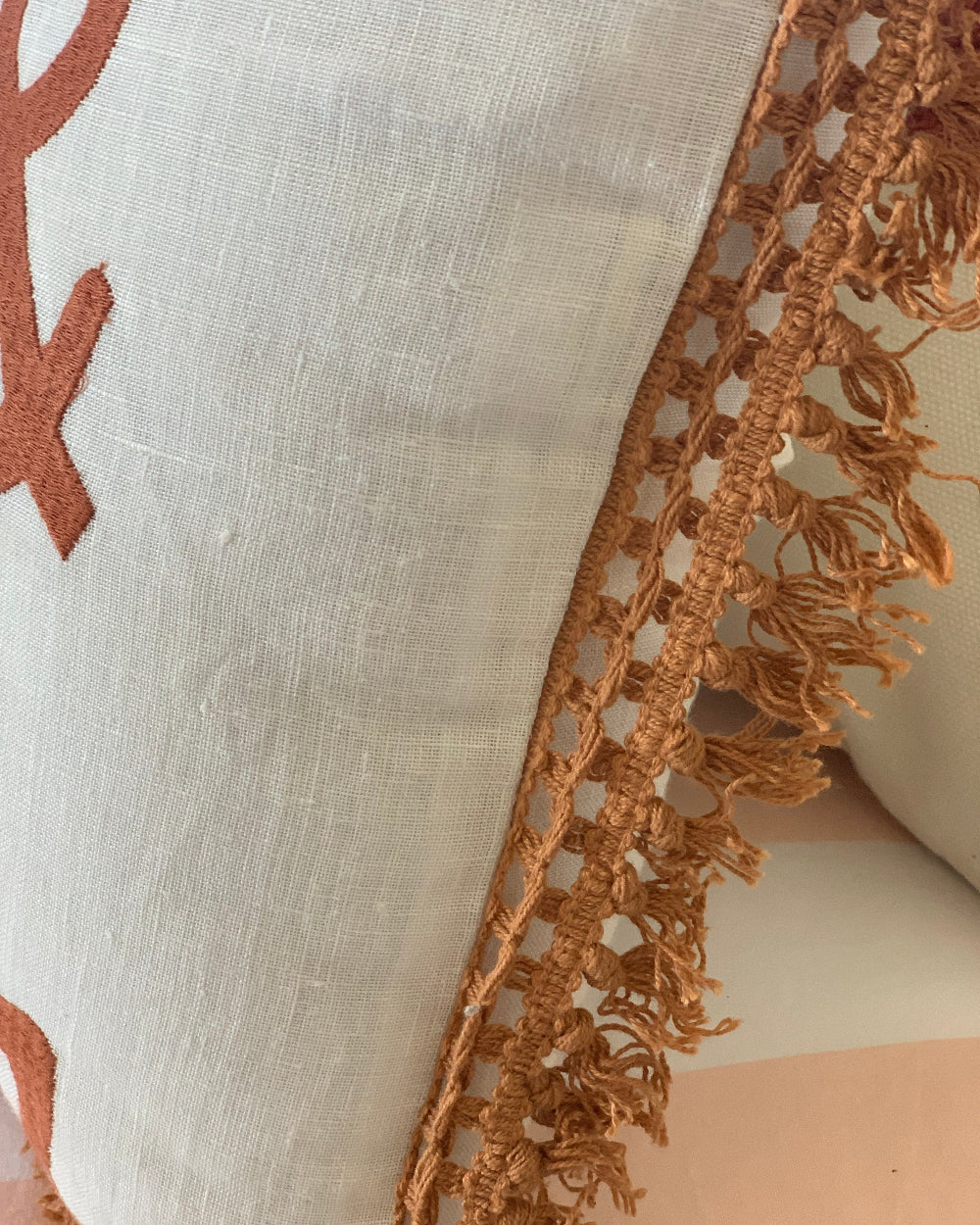 Ivory Linen You Me and The Sea cushion cover with rust embroideredy fringed edgr trim detail