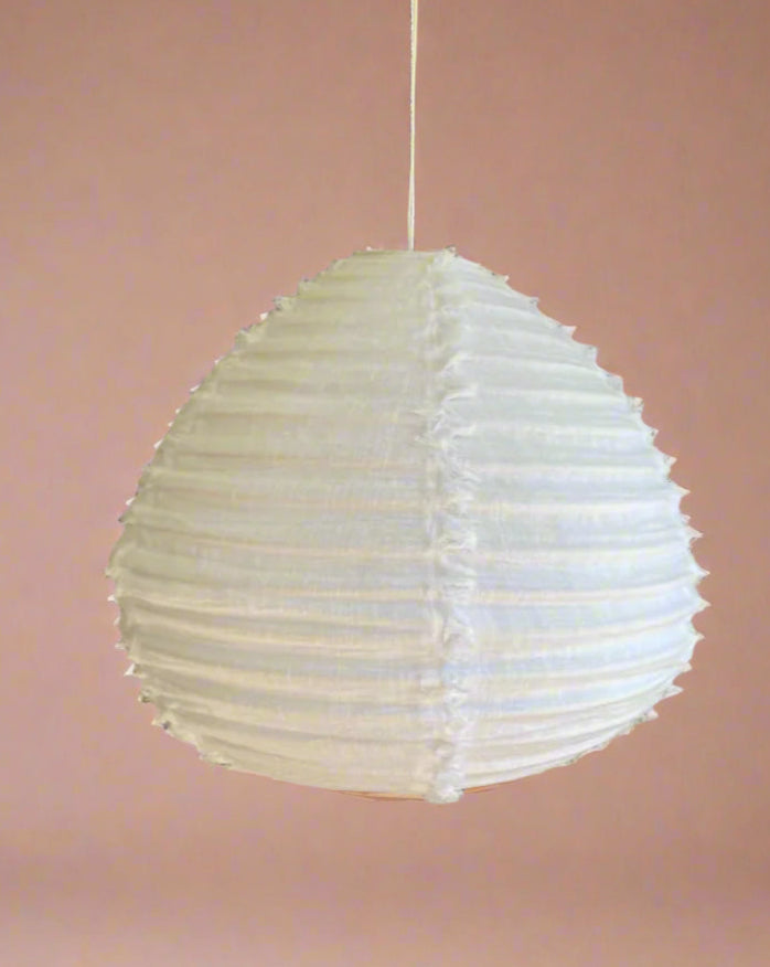 Pear linen fabric light shade, fringed detail in warm white.