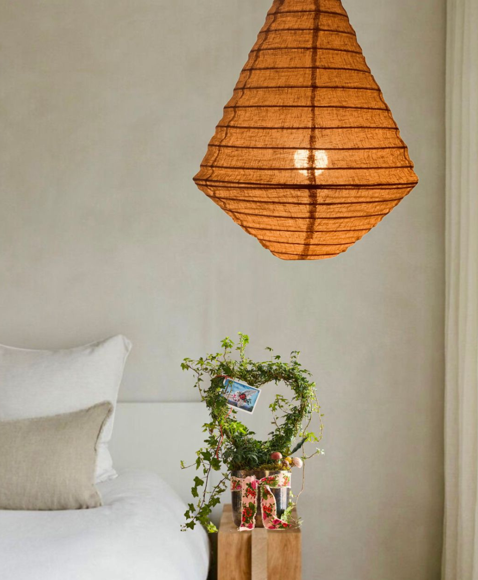 Bedroom with a hanging lamp, diamond-shaped rust organic linen.