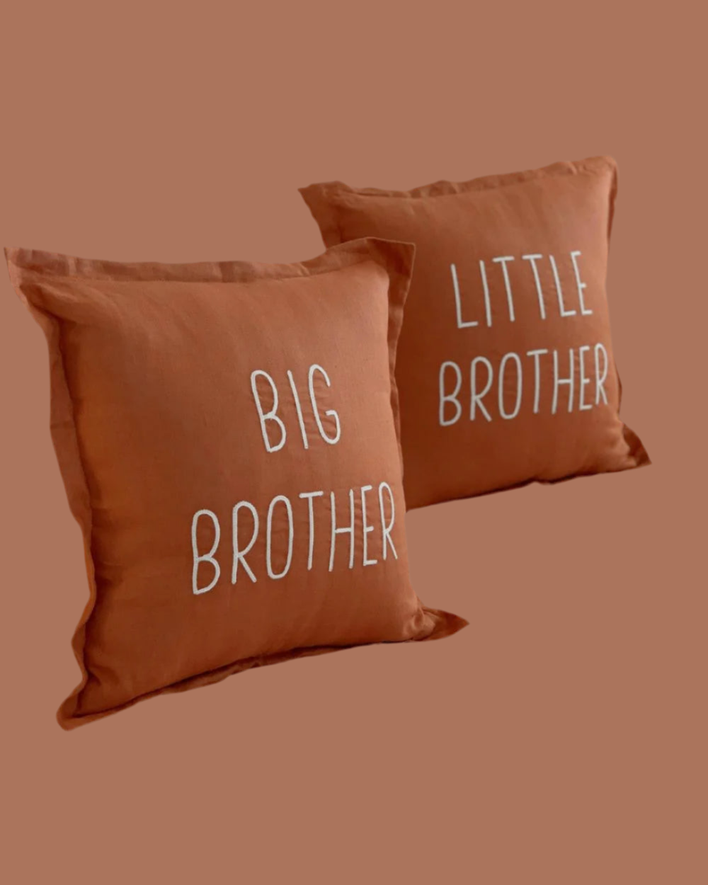 Two brown pillows with 'Big Brother' and 'Little Brother' text on a brown background