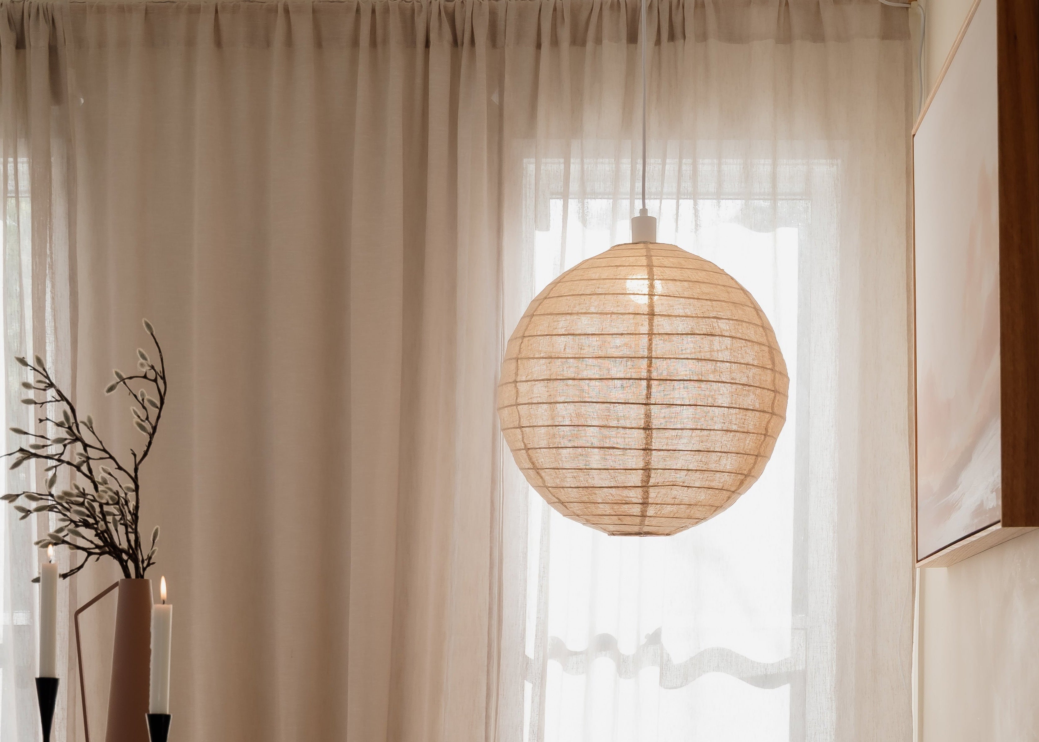 Natural Linen light shade hung swag style over the table