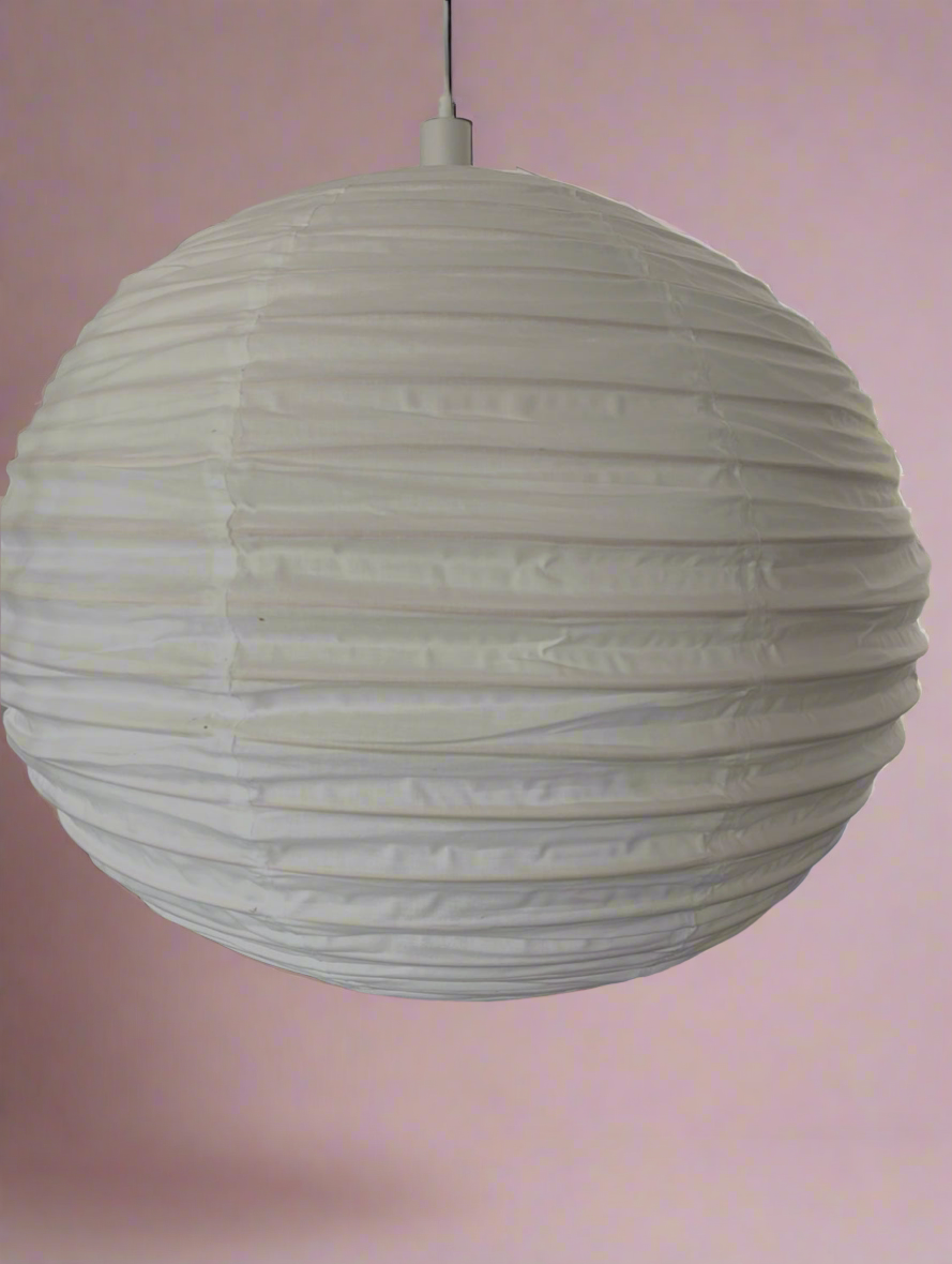 Round Linen lantern with ribbed texture on a pink background