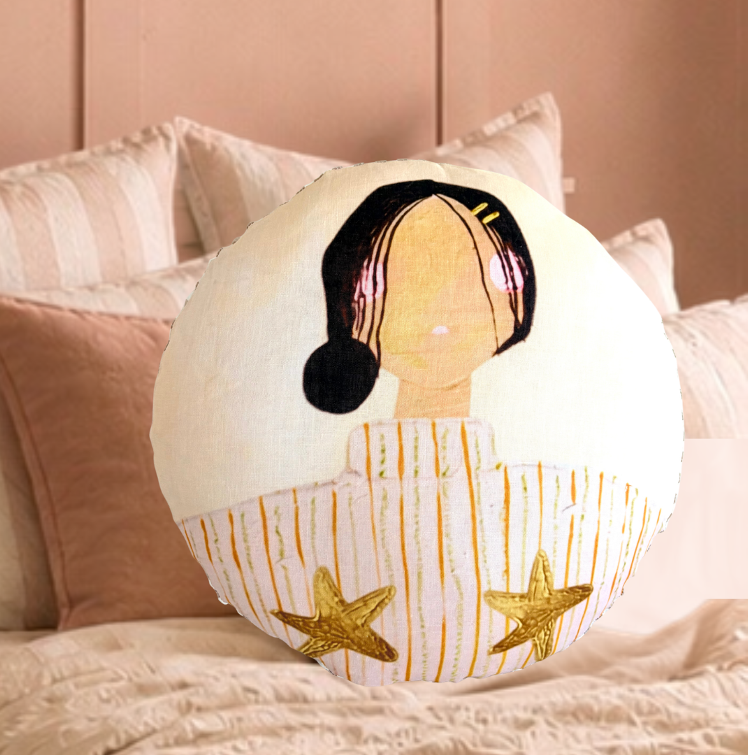 Lottie round linen cushion styled on a neutral bed with globe pendant light by Little Nordic Sol