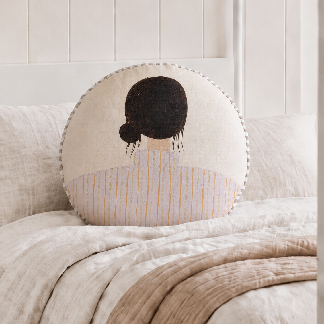 Reverse side of Lottie round linen cushion featuring illustrated girl artwork by Ella Martin for Little Nordic Sol