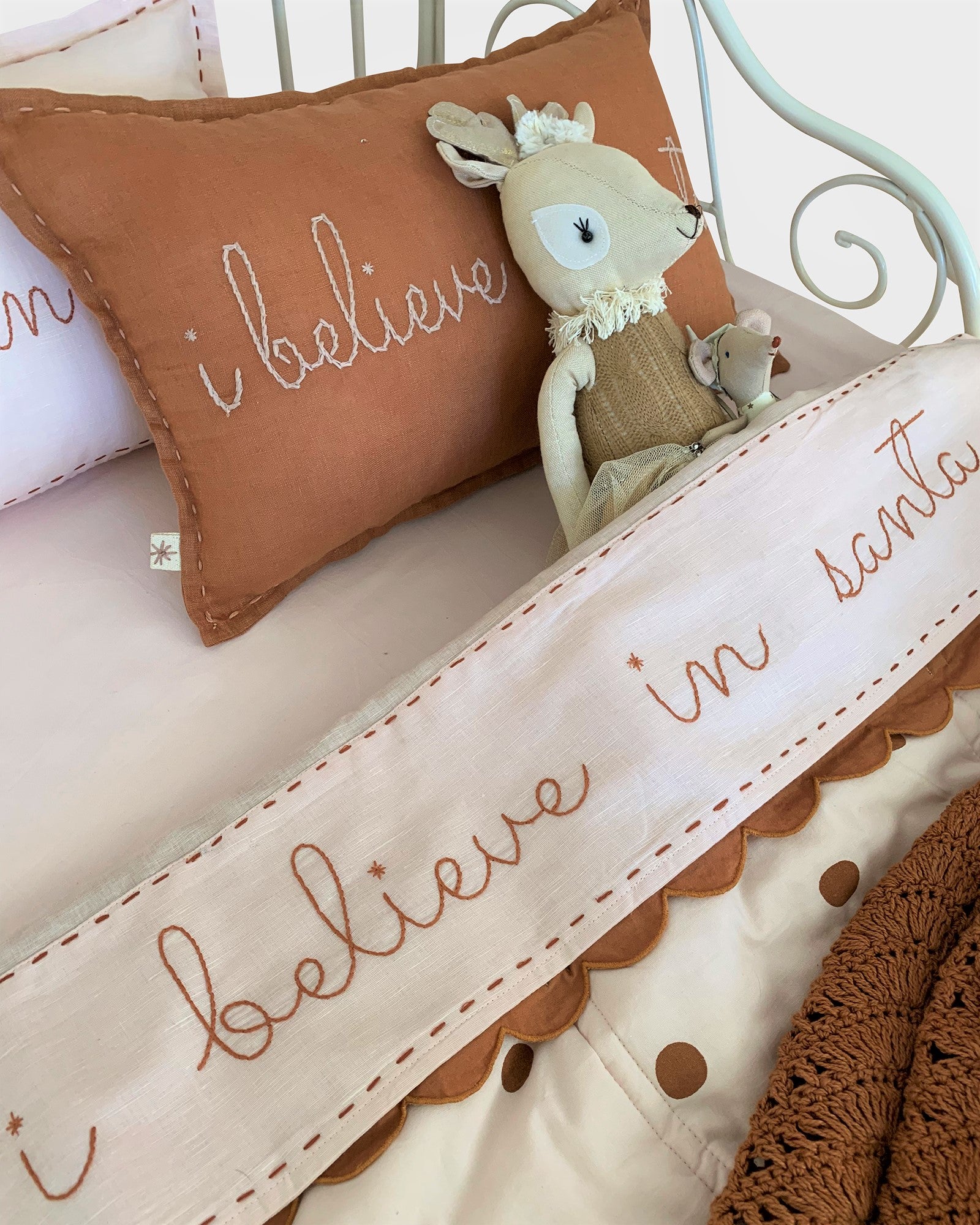 I believe in santa bran oloured cushion