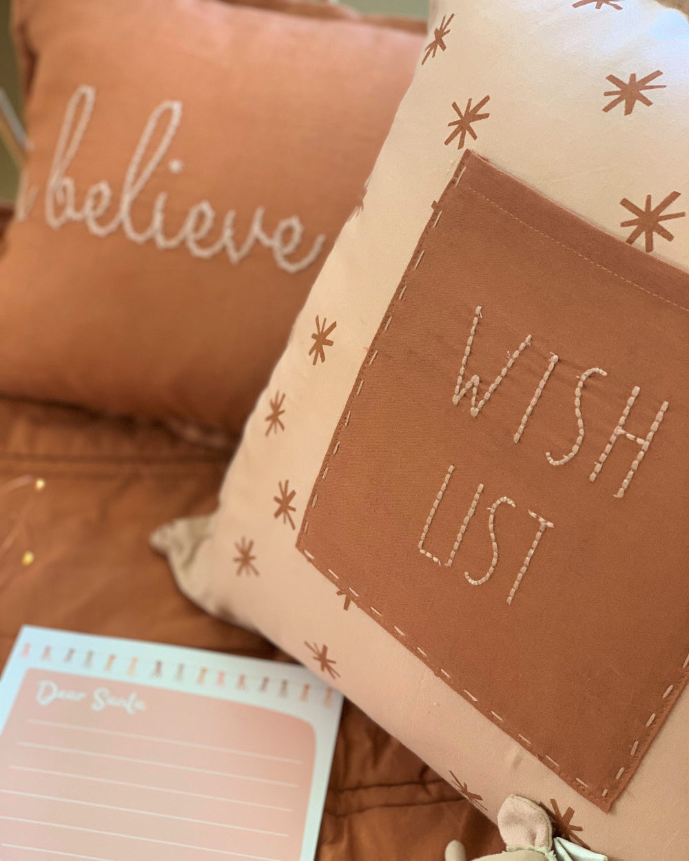 Wish List organic cotton star print cushion with front ocket for holding special notes and wished tan and ivory colour 40cm x 40cm zippr closure