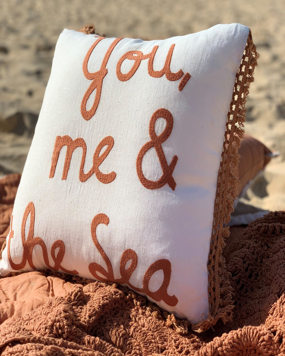 You Me and The Sea Linen cushion cover with bronze embroidered detail and fringe.