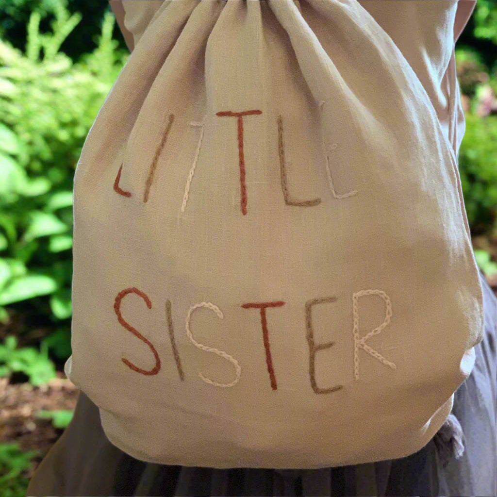 Linen back pack with little sister embroidery